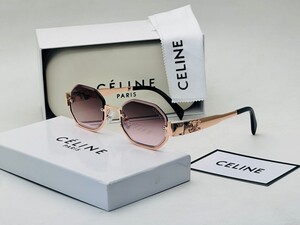 نظارة بإطار وردي ذهبي وعدسات داكنة